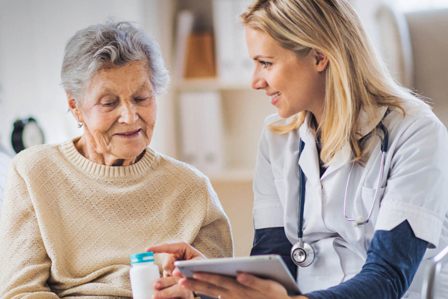 Nurse or carer talking to a older lady