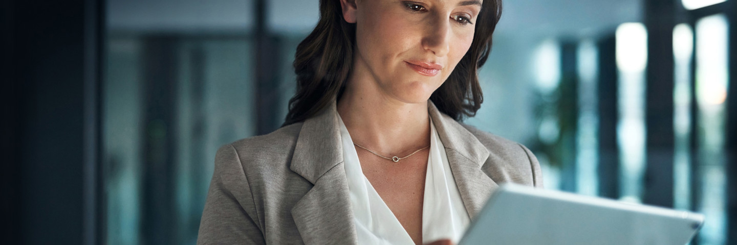 Image of woman looking at tablet