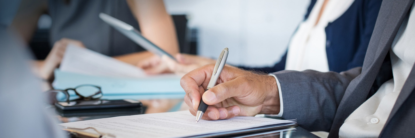 Image of man writing 