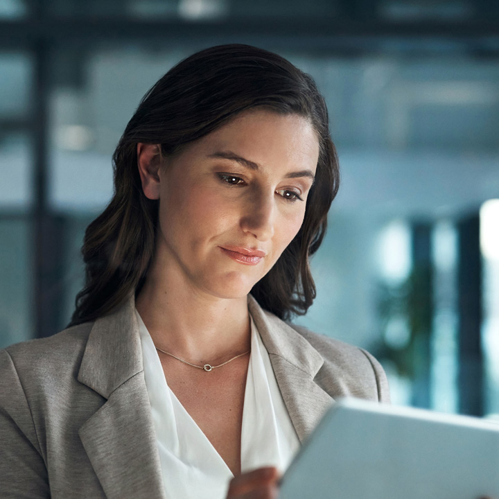 Image of woman looking at tablet