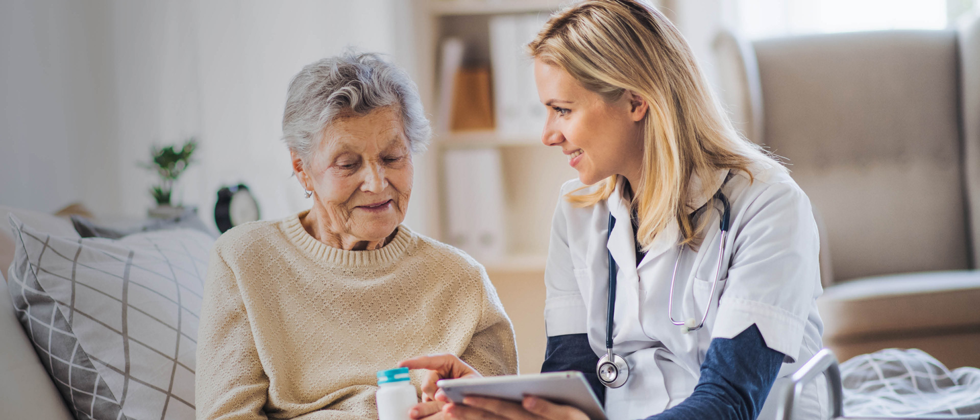 Nurse or carer talking to a older lady