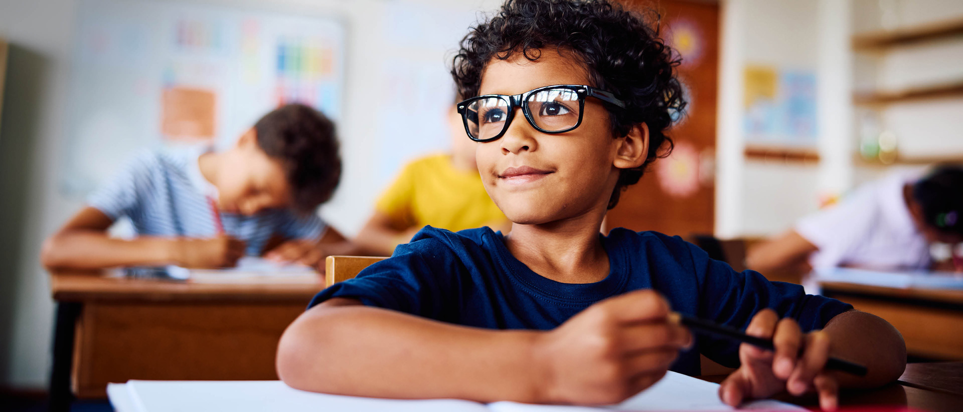 Child with glasses smiling