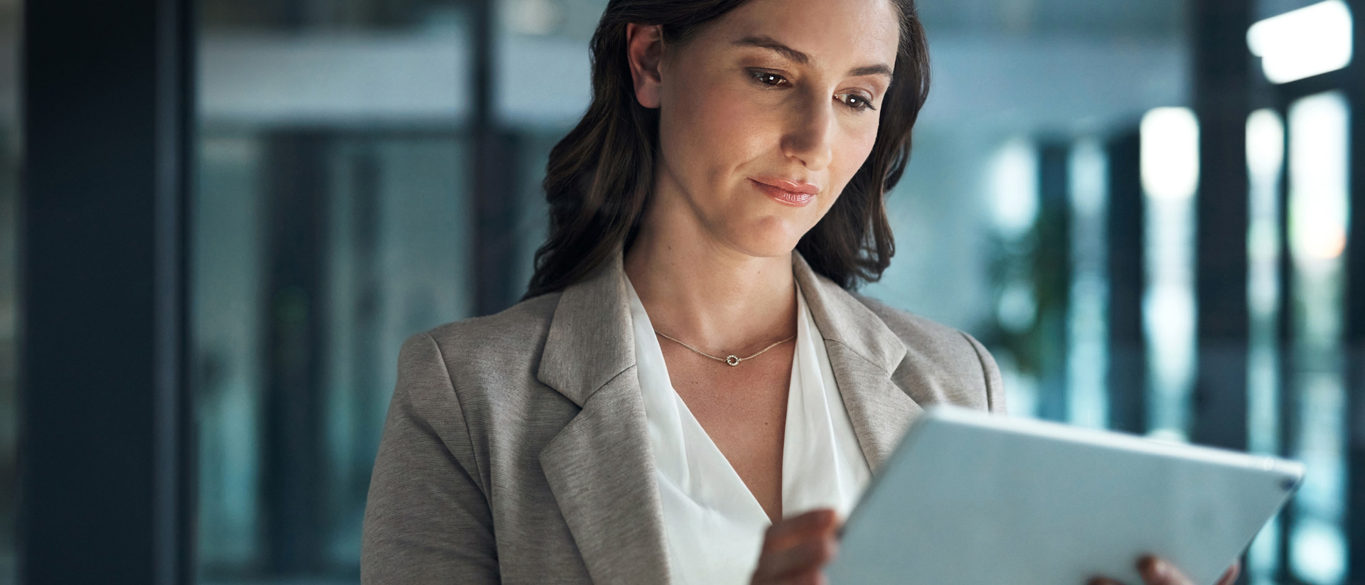 Image of woman looking at tablet