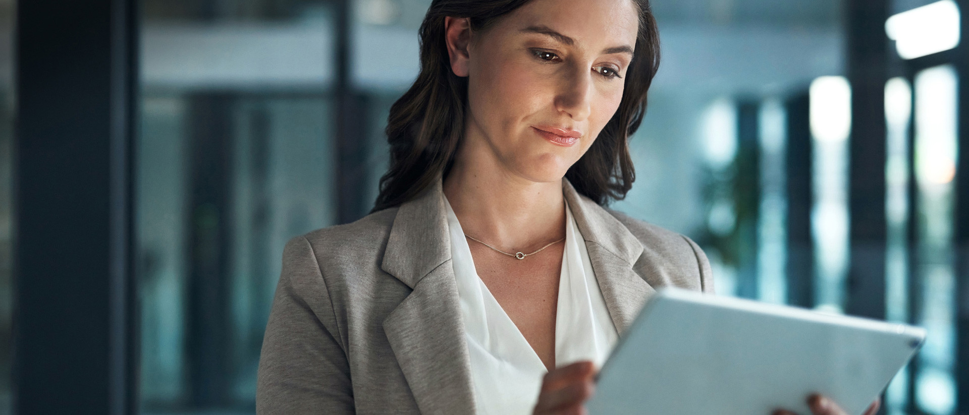 Image of woman looking at tablet