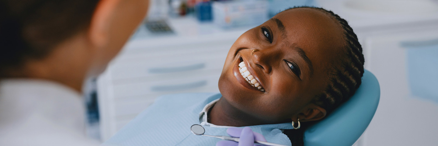 Image of woman smiling at the dentists