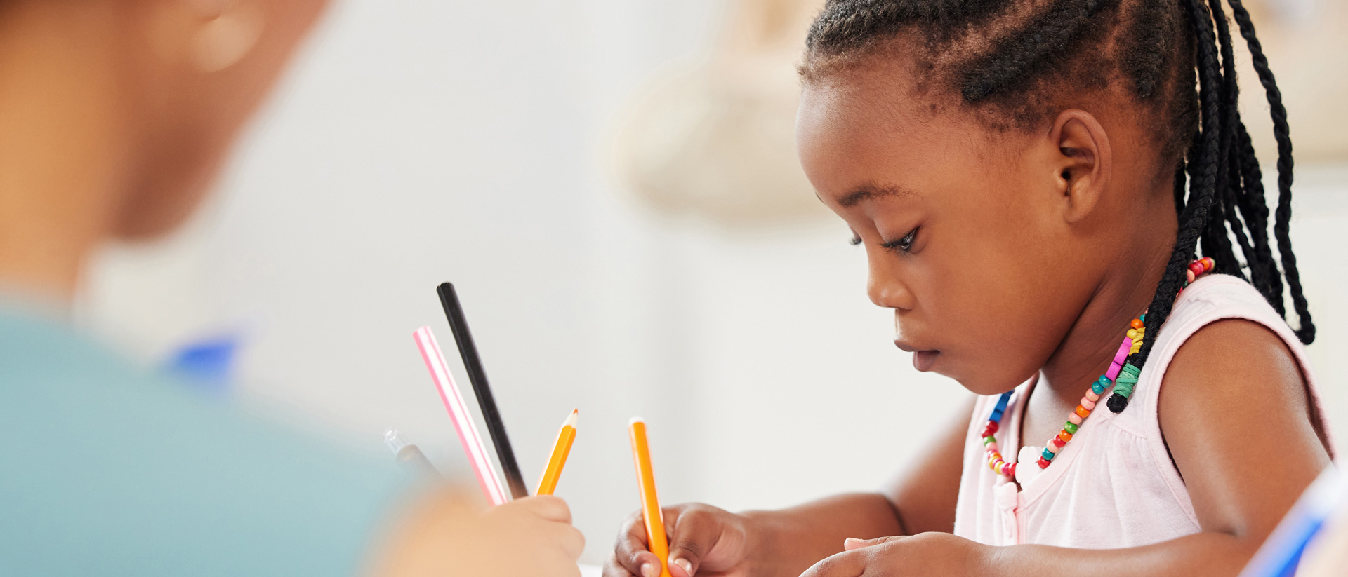 Child colouring in a picture at nursery