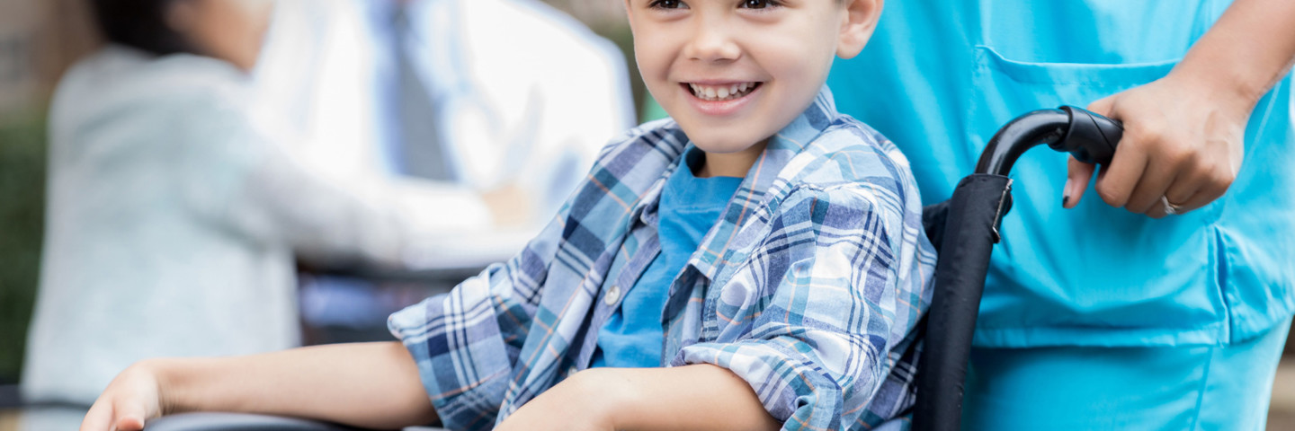 Image of little boy in wheelchair