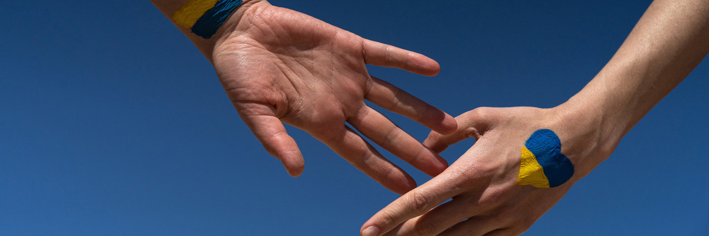 Image of hands reaching for eachother